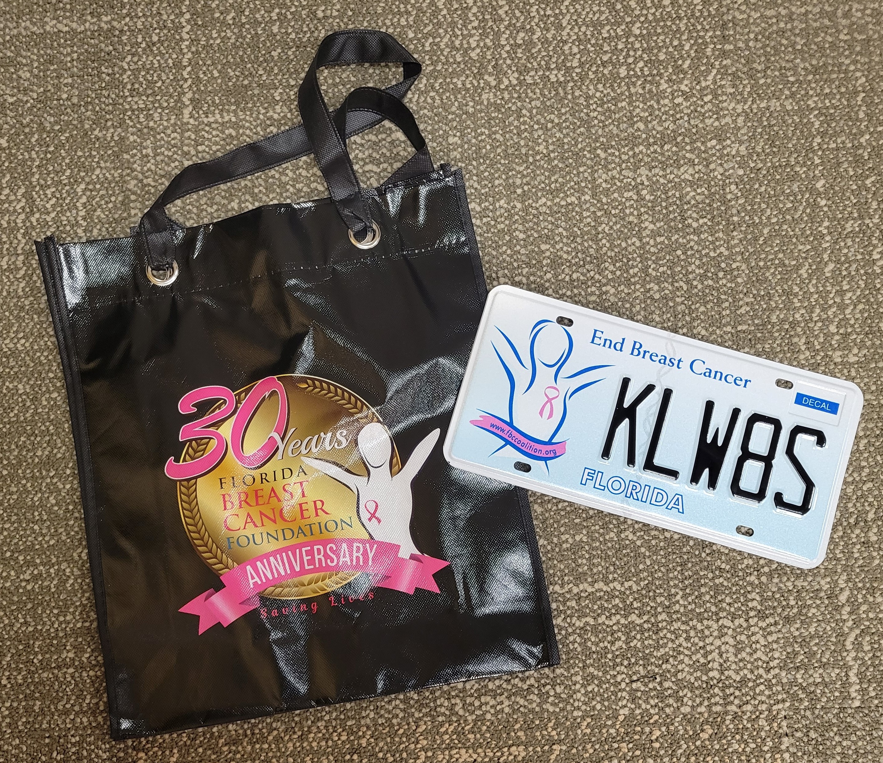 Photo of FL Breast Cancer Foundation specialty plate and tote bag